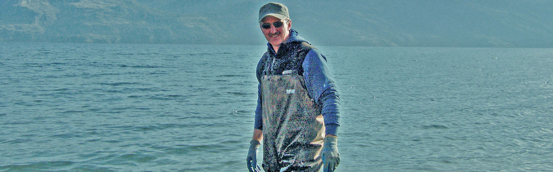 Photo of Dennis Clark connecting water pump for Greata Ranch